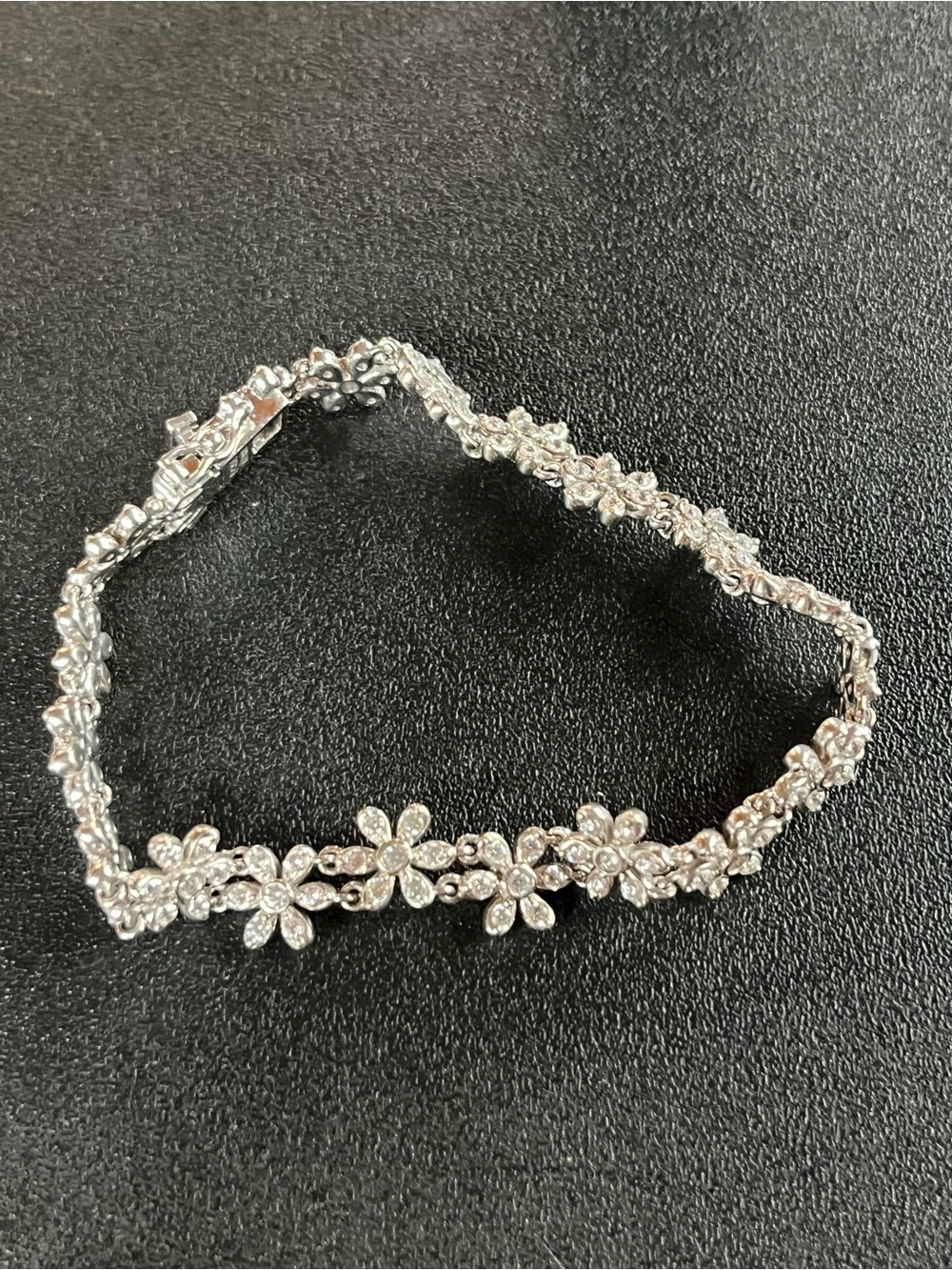 Sterling Silver floral link bracelet with CZs. 7”.